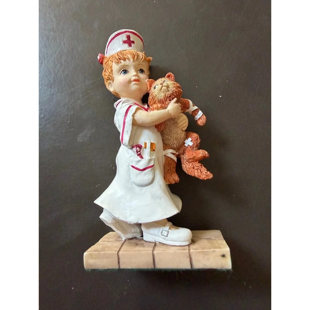 Vintage Nurse Girl Figurine with Bandaged Cat Resin Statue Medical Professional